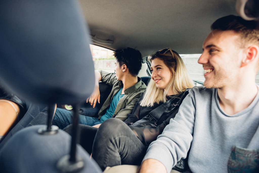 people riding a car