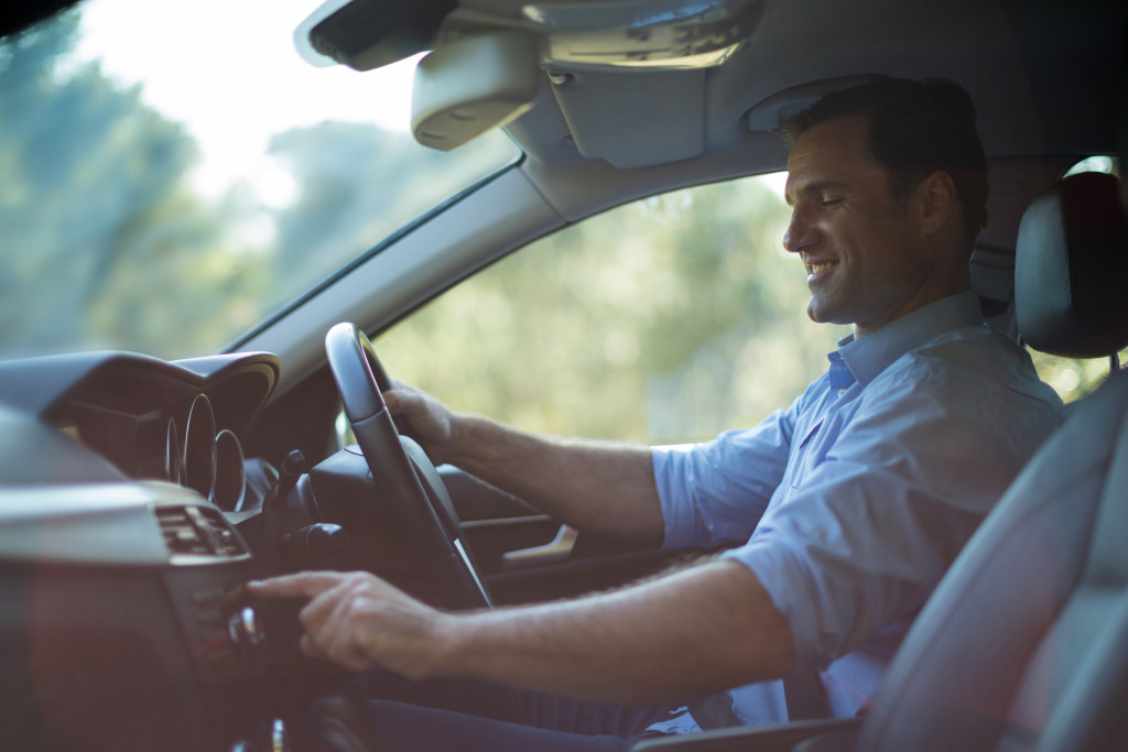man driving a car