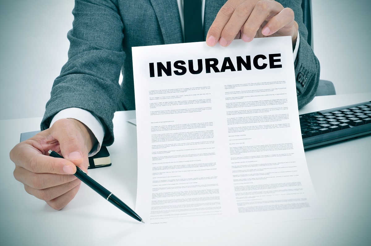 Insurance document and pen